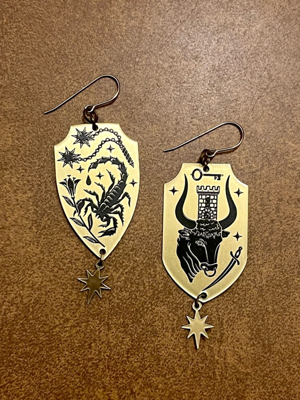 While Odin Sleeps Brass Zodiac Shield Drop Earrings with Scorpion & Bull Motifs